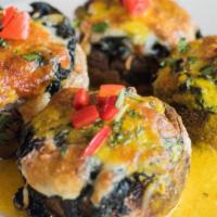 Champinones Barcelona · Mushrooms stuffed with spinach, pine nuts, manchego cheese with saffron lemon butter. Gluten...