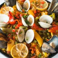 Paella Mixta · Shrimp, chicken, chorizo, clams, mussels and vegetables. Paellas are freshly prepared and ba...