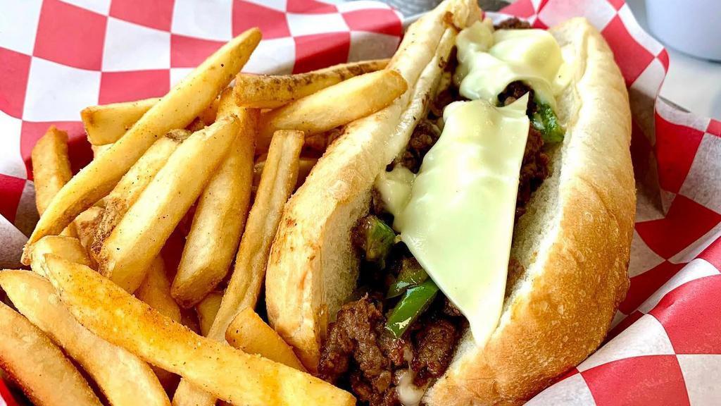 Philly Steak · Freshly cut Angus steak, grilled onions, green pepper, and Swiss cheese.