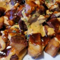 Pork Belly Bites · Melt-in-your-mouth, all natural, hickory smoked diced pork belly served over steak fries and...