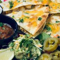 Chicken Quesadilla · A flour tortilla stuffed with chicken, grilled onions and bell peppers, and melted Cheddar c...