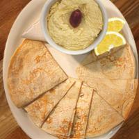 Hummus & Olga Bread · Creamy hummus served with the best bread on the planet.
