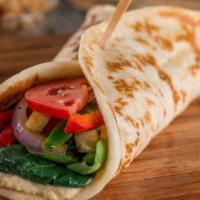 Veggie · Filled with sauteed fresh zucchini, bell peppers and red onion. Layered with fresh greens, t...