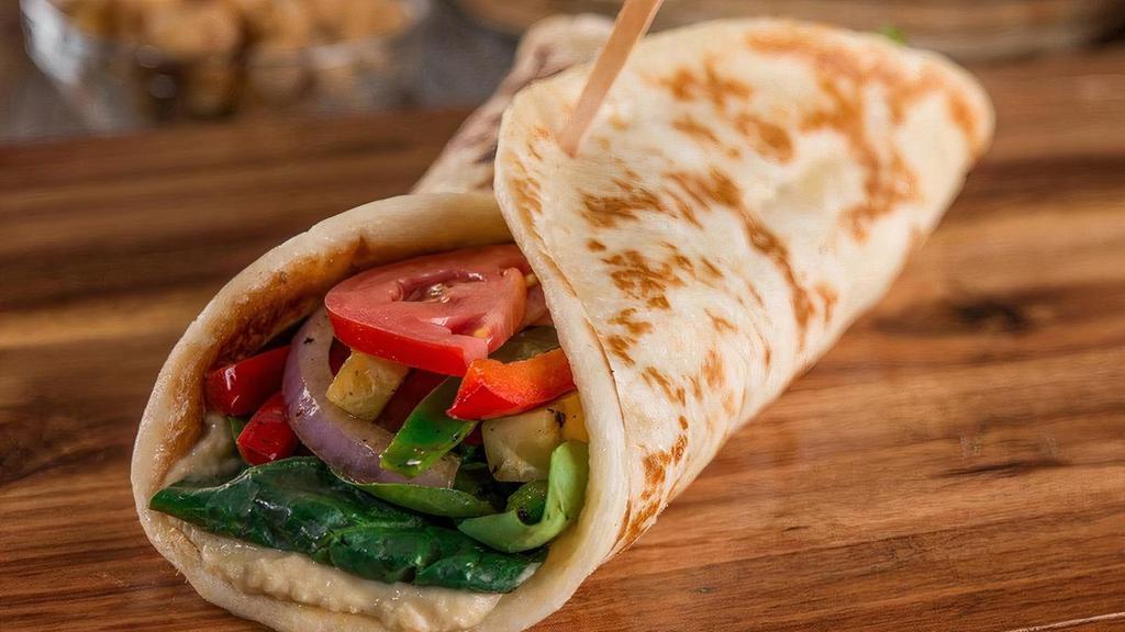 Veggie · Filled with sauteed fresh zucchini, bell peppers and red onion. Layered with fresh greens, tomato, and finished with hummus and herb dressing.