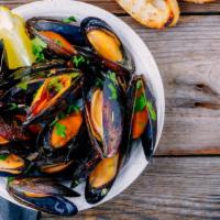 Pei Mussels · Fresh Prince Edward mussels sautéed in wine with a touch of lemon, garlic and chorizo, serve...