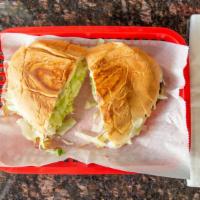 Steak Tortas · Served with beans, cheese, sour cream, lettuce, tomato, and avocado.