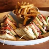 Clubhouse Sandwich · Bacon, ham, turkey, lettuce, tomato, mozzarella, cheddar and mayonnaise layered on toasted w...