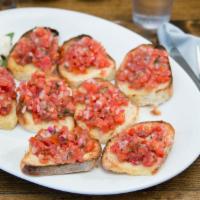 Bruschetta · Chopped fresh roma tomatoes with garlic, basil, olive oil, red onions and vinegar served on ...