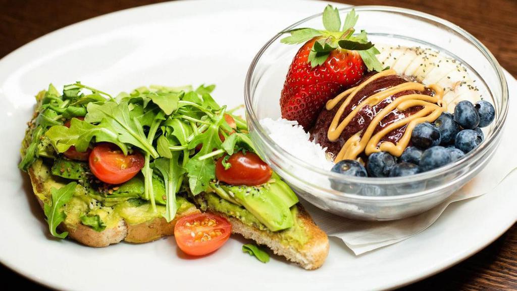 Avocado Toast & Acai Bowl · multi-grain bread with guacamole, topped with avocado, slices, arugula, grape tomatoes and signature seasoning. served with acai sorbet on granola, with bananas, berries, coconut flakes and a pinch of chia seeds, drizzled with peanut butter and honey