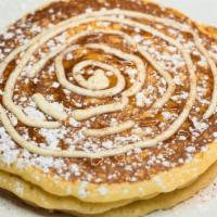 Cinnamon Roll Pancakes · caramel and cream cheese frosting swirled into 3 made-from-scratch buttermilk pancakes, dust...