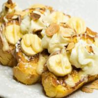 Banana Cream French Toast · 4 slices of vanilla-battered french toast with fresh bananas, whipped cream and toasted almo...