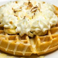 Banana Cream Waffle · belgian waffle topped vanilla cream drizzle, bananas, whipped cream and toasted almonds.