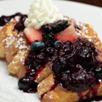 Triple Berry French Toast · 4 slices of vanilla-battered french toast topped with triple berry compote and fresh whipped...