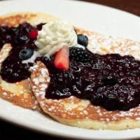 Triple Berry Pancakes · 3 made-from-scratch buttermilk pancakes with fresh berries, triple berry compote and whipped...