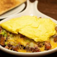 Denver Skillet · diced ham, fresh green peppers and onions, and melted cheese.
