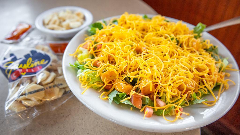 Buffalo Chicken Salad · Spicy buffalo sauce with diced chicken breast, lettuce, tomatoes and shredded cheddar cheese. Add your choice of dressing.
