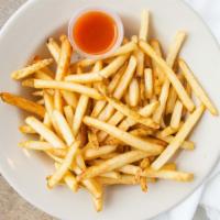 Fries · A heaping plate of crispy French fries.
