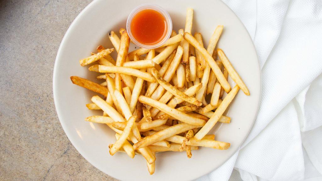 Fries · A heaping plate of crispy French fries.