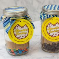 Cookie Mix Jar · A mason jar with all of the dry ingredients and the recipe to make 2 dozen cookies. Just add...