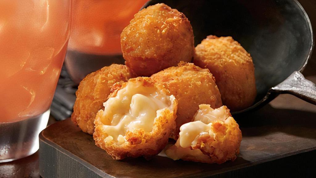 Steakhouse Mac & Cheese Bites · Eight golden bites filled with macaroni, Asiago,
Mozzarella and Parmesan cheese. Served with
house-made ranch dressing.