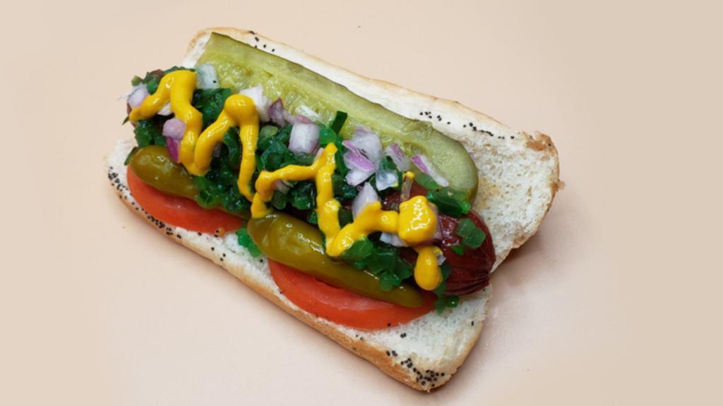 Chicago Dawg · Made the authentic Chicago way! Premium all-beef frank on a soft poppy seed roll with dill pickle spear, neon green Chicago relish, chopped onion, sliced tomato, sport peppers and celery salt.