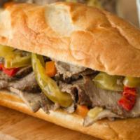 Italian Beef Sandwich · Tender, thin-sliced roasted round of beef seasoned with Italian spices, dipped in warm au ju...