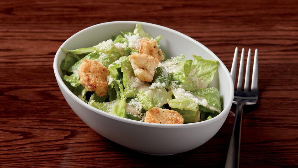 Caesar Side Salad* · 280 cal. fresh romaine, housemade croutons & Parmesan cheese served with Caesar dressing. dressing is made with raw egg yolks.