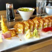 Cancun Roll (8 Pc) · Shrimp tempura, spicy tuna, avocado and cucumber wrapped in soy paper. Topped with spicy sno...