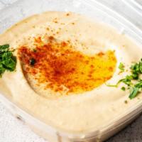 Hummus · Traditional Hummus, made with Chickpeas, Tahini, Garlic, Spices, EVOO. Vegan + Gluten-Free