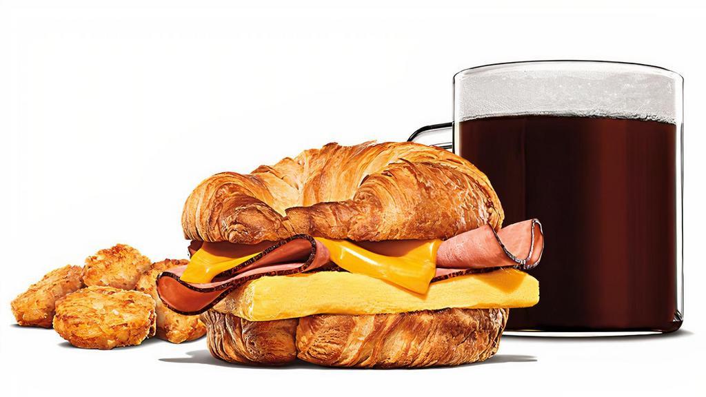 Ham, Egg & Cheese Croissan'Wich Meal · Black Forest ham, fluffy eggs, and melted American cheese on a toasted croissant. Served with Hash Browns and your choice of Drink.