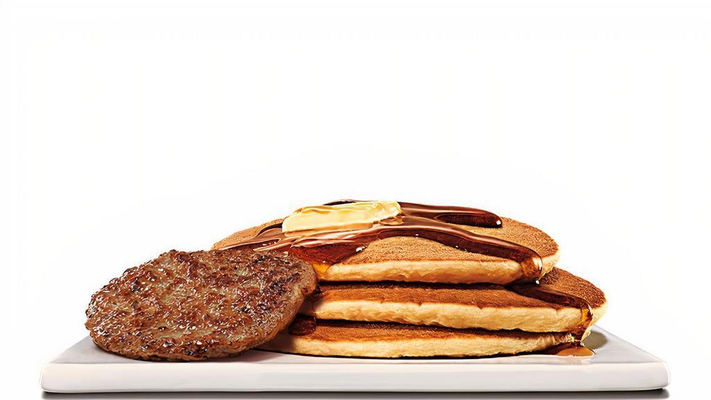 Pancakes & Sausage Platter · Three fluffy pancakes drizzled in syrup with a side of sizzling sausage.