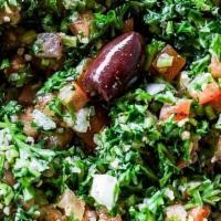 Tabouli · Vegan. A delicate mixture of chopped parsley, sweet onions, diced tomatoes, bulgur, lemon ju...