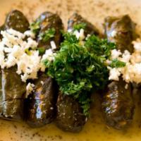 Dawali · Gluten-Free. Rolled grape leaves stuffed with rice, chickpeas, tomatoes, and parsley, topped...