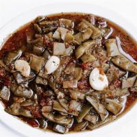 Loubie Bzeit · Vegan, Gluten-Free. Italian green beans sautéed with onions, whole cloves of garlic, fresh t...