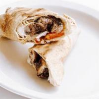 Chicken Shawarma Rolled · Grilled, seasoned chicken thigh, tomatoes, onions, and Tahini Lemon dressing