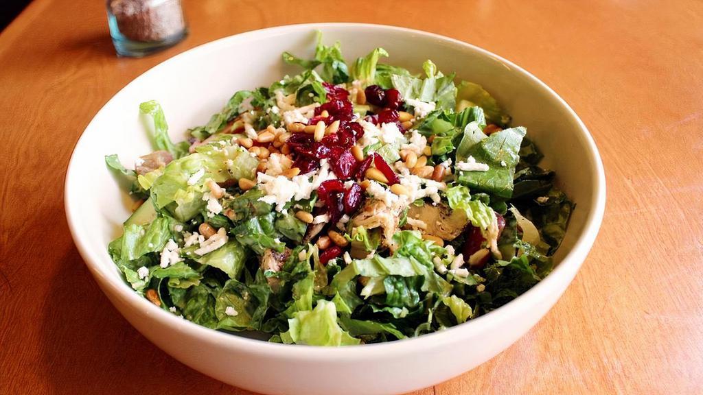 Taza Chicken Salad · Gluten-Free, Contains Nuts. Mixed greens, yellow squash, zucchini, grapes, tomatoes, and chopped grilled chicken tenders tossed with honey dijon dressing and topped with feta, dried cranberries, and lightly fried pine nuts