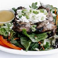 Chicken Mishwi Salad · Gluten-Free. Grilled, seasoned chicken thigh over mixed greens, sliced tomatoes and cucumber...