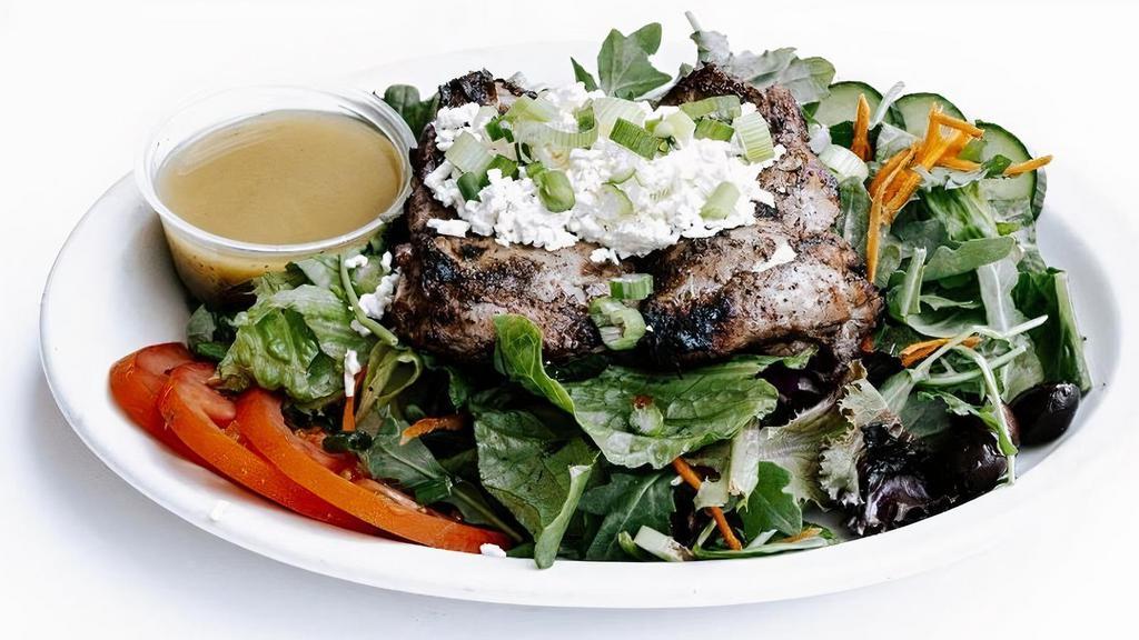 Chicken Mishwi Salad · Gluten-Free. Grilled, seasoned chicken thigh over mixed greens, sliced tomatoes and cucumbers, calamata olives, scallions, and feta; choice of dressing