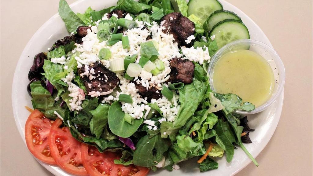 Shish Kabob Salad · Gluten-Free. Grilled beef tenderloin over mixed greens, sliced tomatoes and cucumbers, calamata olives, scallions, and feta; choice of dressing