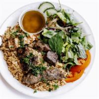 Aladdin Favorite Combo · Beef Kafta, Shish Kabob, and Shish Tawook on a bed of brown rice with vermicelli; served wit...