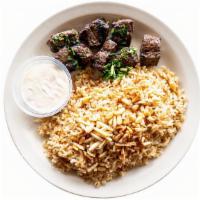 Mediterranean Shish Kabob Plate · Contains Nuts. Grilled beef tenders served with brown rice with vermicelli, lightly fried pi...