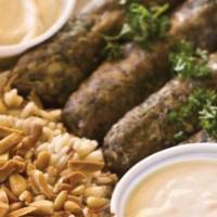 Mediterranean Beef Kafta Plate · Contains Nuts. Beef Kafta served with seasoned brown rice with vermicelli, lightly fried pin...