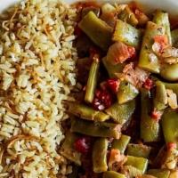 Loubie Plate · Vegan. Italian green beans sautéed with onions, fresh tomatoes, and whole cloves of garlic, ...