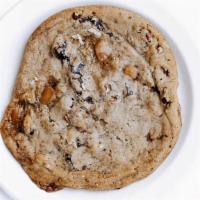 Caramel Pecan Cookie · Contains Nuts. Homemade chocolate chip cookie with pecan pieces and swirls of caramel.