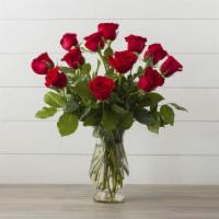 Debi Lilly Dozen Rose Arrangement · Custom designed dozen roses in a vase