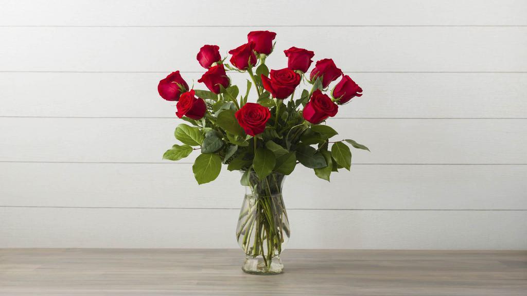 Debi Lilly Dozen Rose Arrangement · Custom designed dozen roses in a vase