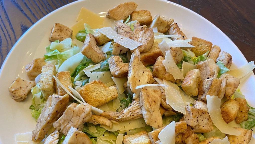 Caesar Salad With Chicken · Romaine Lettuce, Croutons & Parmesan cheese and Chicken.