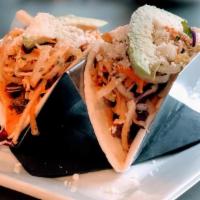 Korean Short Rib Tacos · Ginger-braised beef, avocado, queso fresco, daikon radish slaw, thai chile aioli, sambal hot...