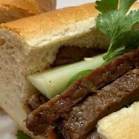 Bo · Banh Mi Bo Nuong. Grilled Beef Sandwich. Grilled marinated beef strips, mayo, jalapeno, pick...
