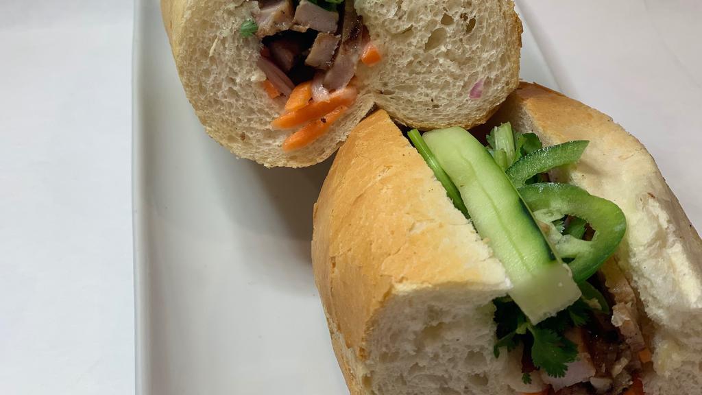 Heo · Banh Mi Heo Nuong. Grilled Pork Sandwich. Grilled marinated pork chop strips, mayo, jalapeno, pickled carrots, cucumber, cilantro, red onion, spicy fish sauce.